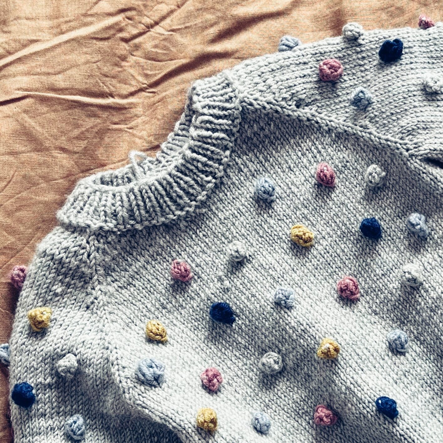 gray merino sweater with colorful bubbles