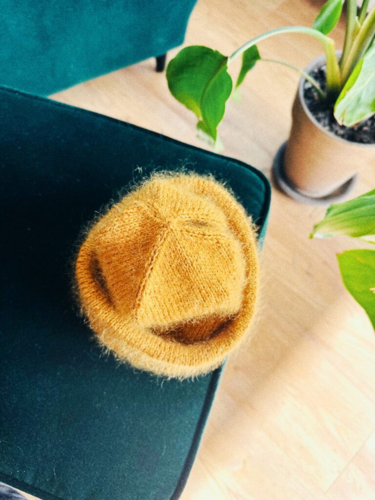 mustard merino - mohair handmade winter hat on a green couch